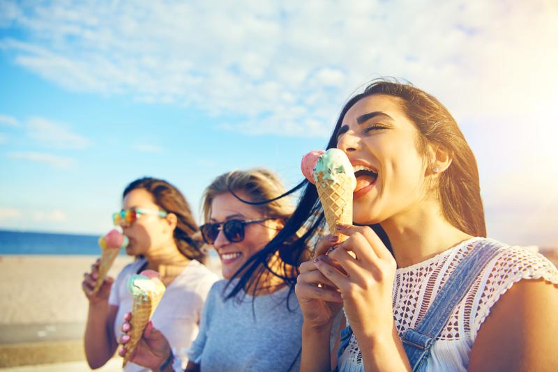 Women eating ice cream at the beach