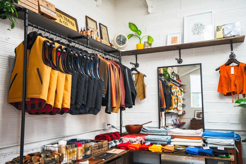Clothing items including vests and jackets on display Inside Temescal Alley Shop of Oakland CA
