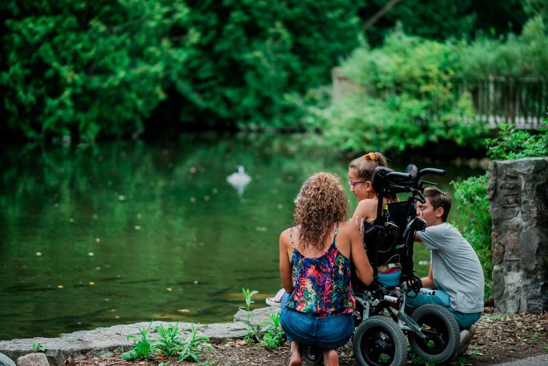 family looking at lake