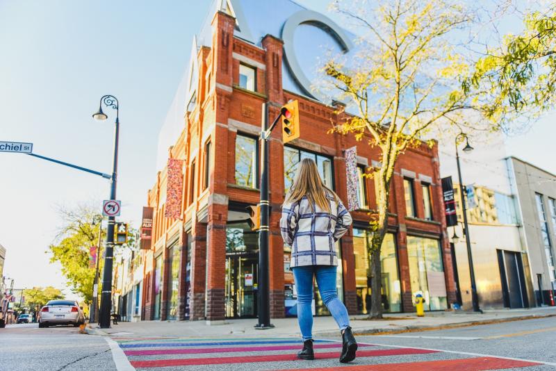 Woman walking to gallery