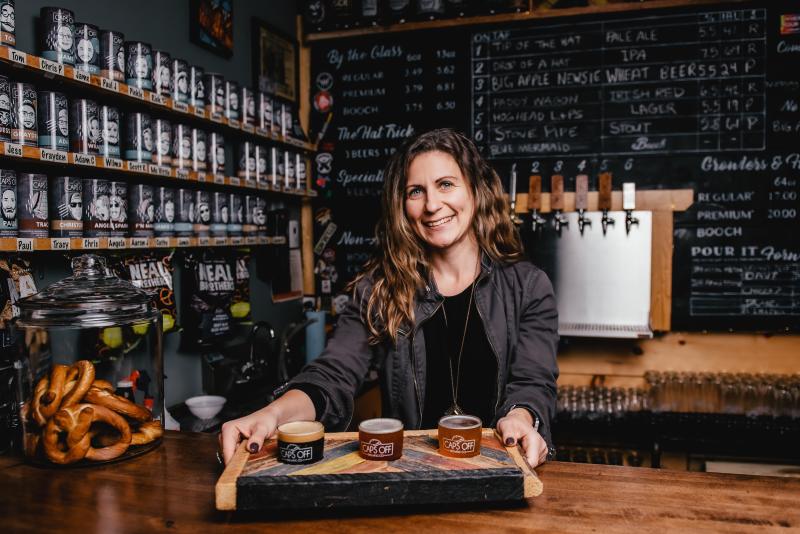 women serving beer sampler