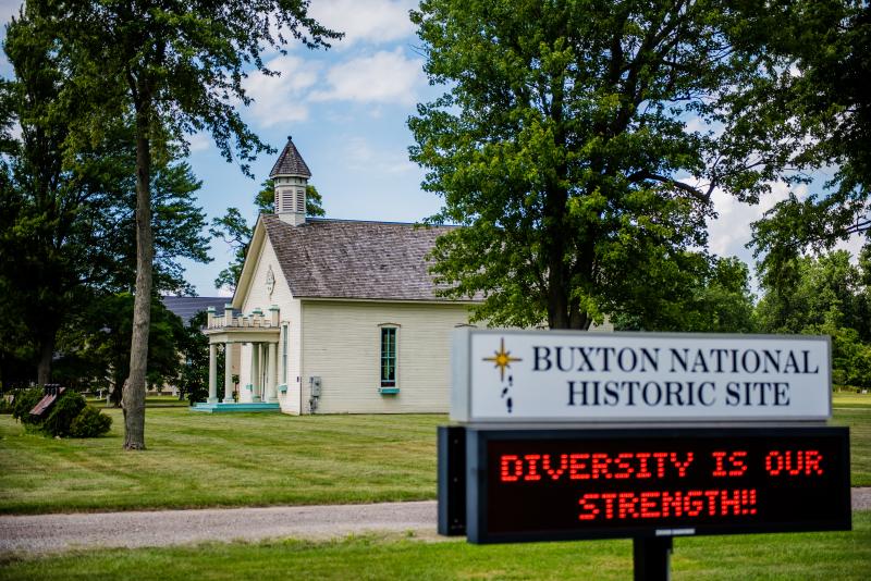 Buxton School House with Sign