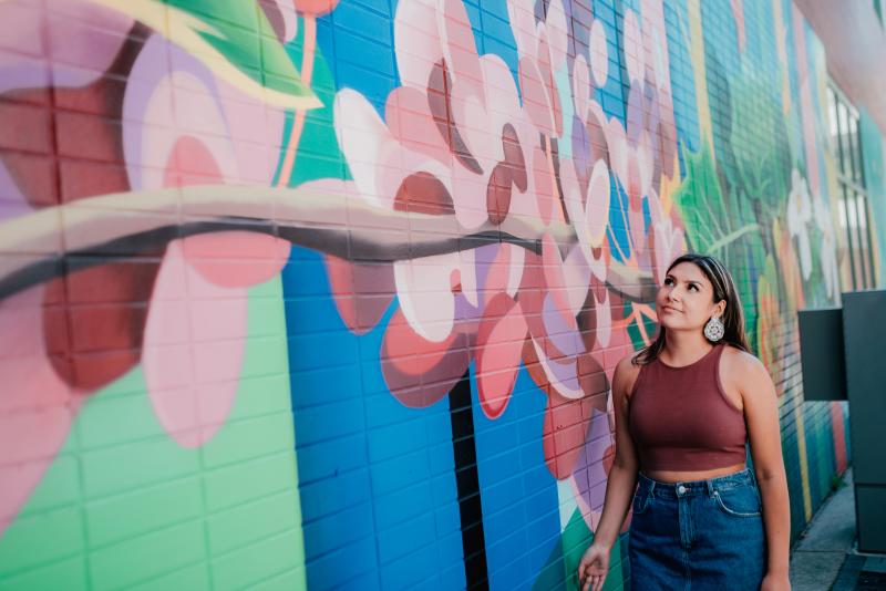 woman looking at mural