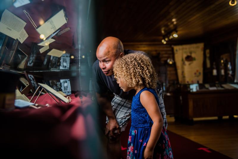 father daughter looking at museum display