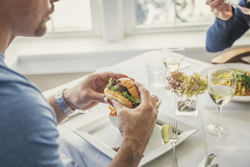 man holding burger