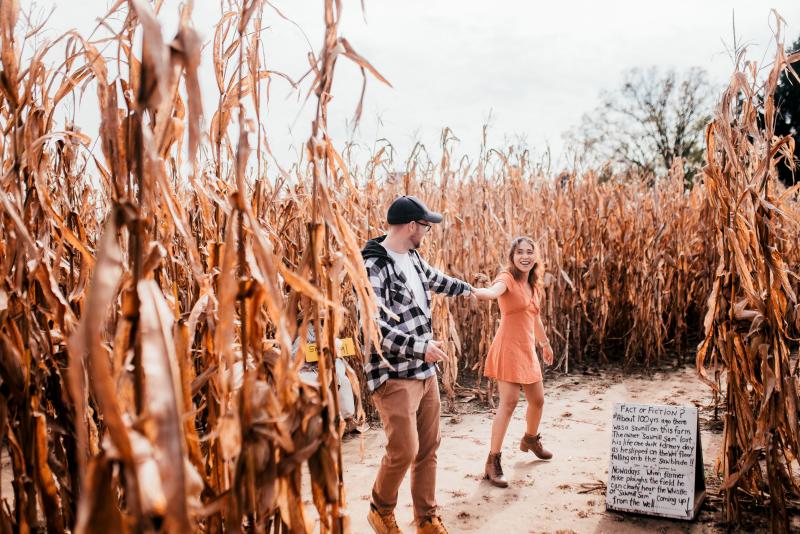 two people in a corn maze