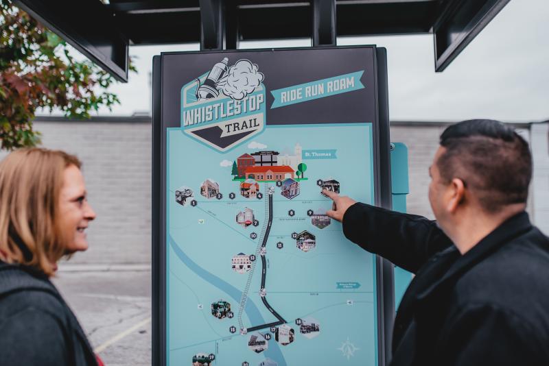 couple looking at trail sign