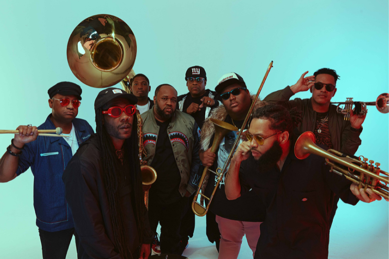 Members of the group The Soul Rebels pose for a photo with their instruments