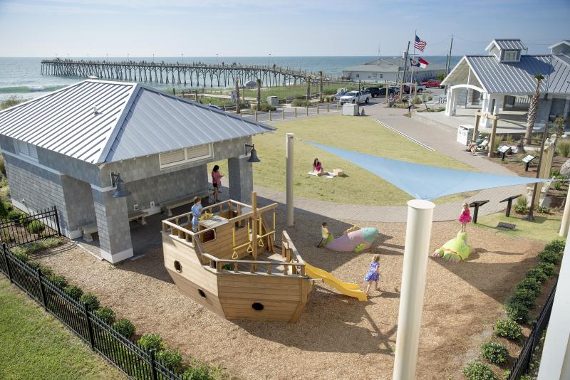 Children Playing On Playground Overlooking The Ocean At Kure Oceanfront Park