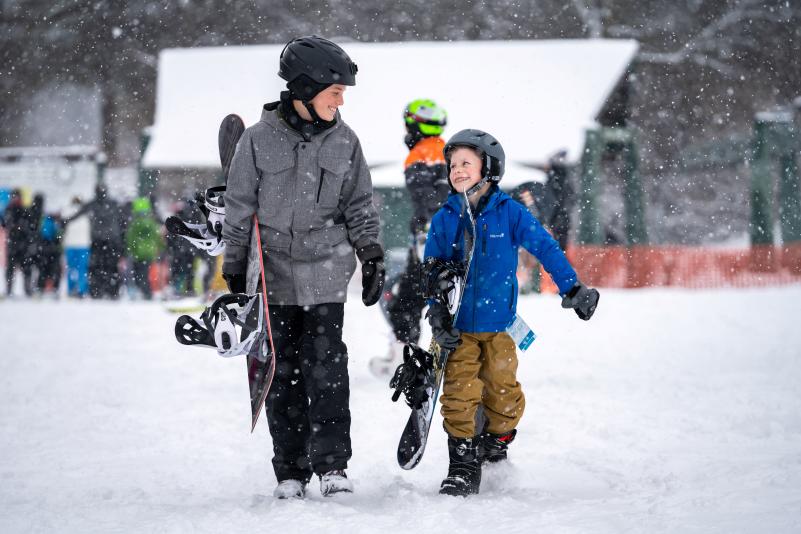 Kids snow boarding at the Mountaintop