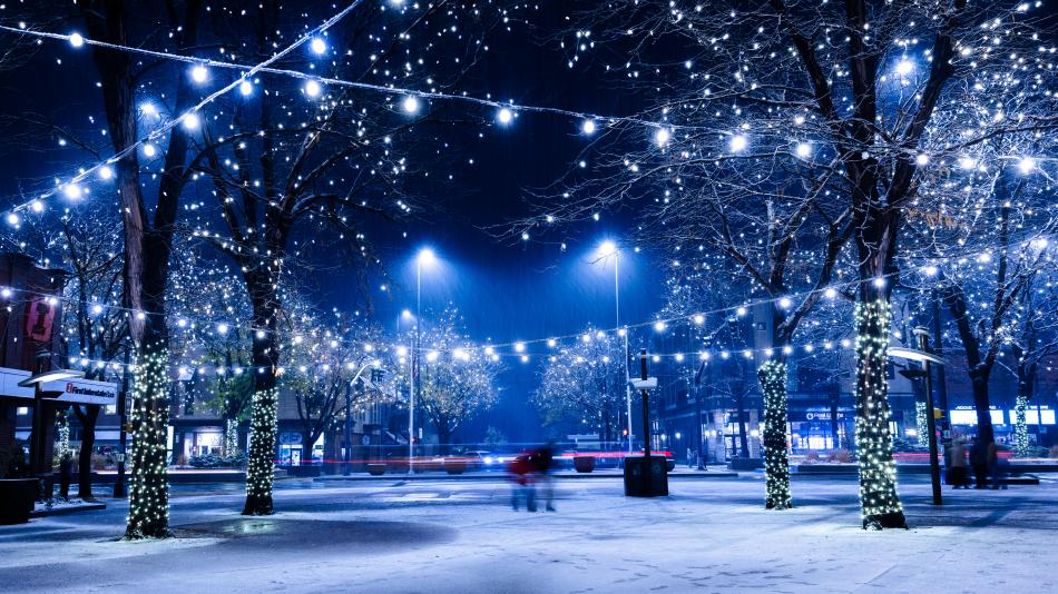 A plaza with lights in the snow