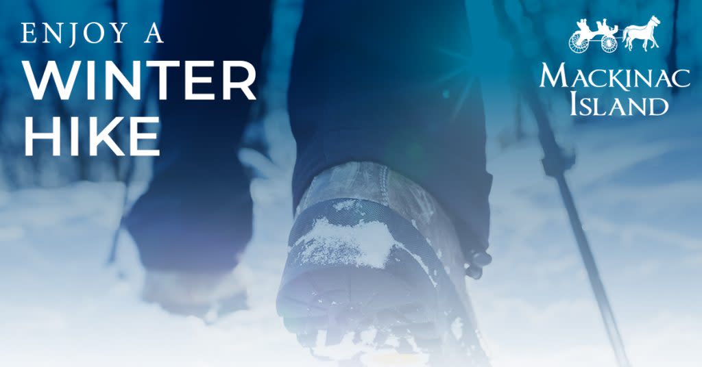 "Enjoy a Winter Hike" on Mackinac Island is written over an image of a person's feet in hiking boots walking through the snow