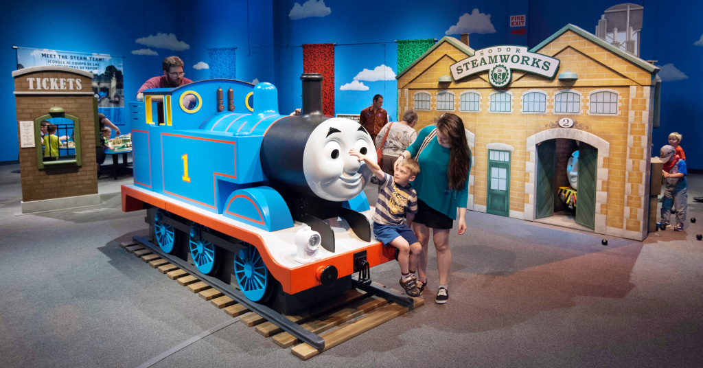Children play on Thomas the Train at the Thomas and Friends exhibit
