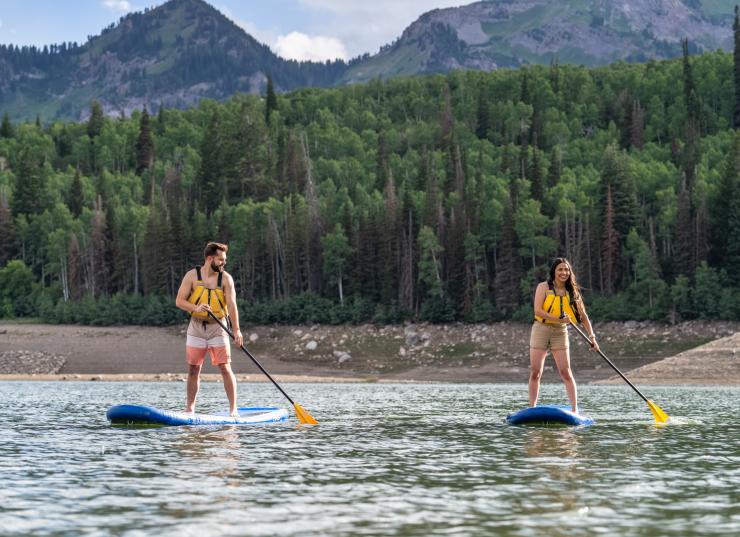 couple paddleboarding on Silver Lake Flat