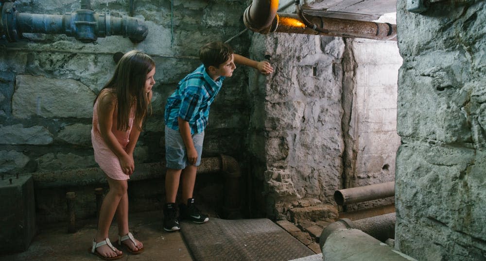 Children explore the basement of Pythian Castle