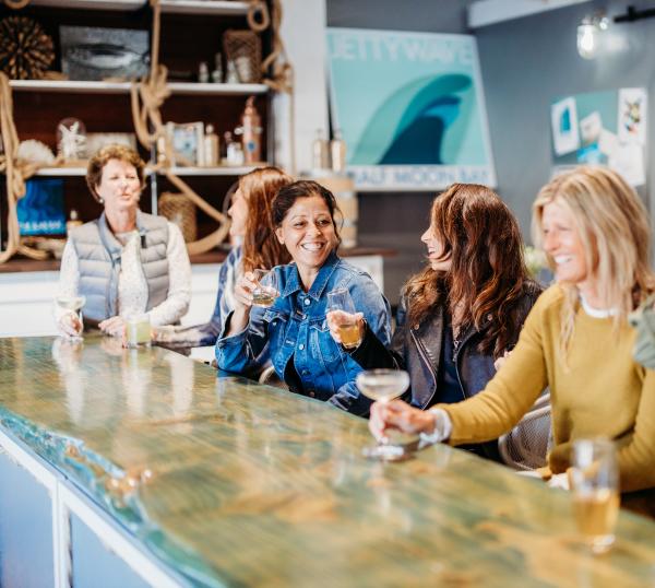 Women at the bar of Jettywave Distillery