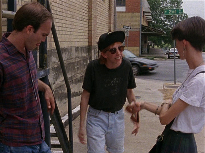 Slacker screengrab, two women and a man talking on the sidewalk at 2nd Street and Guadalupe Street