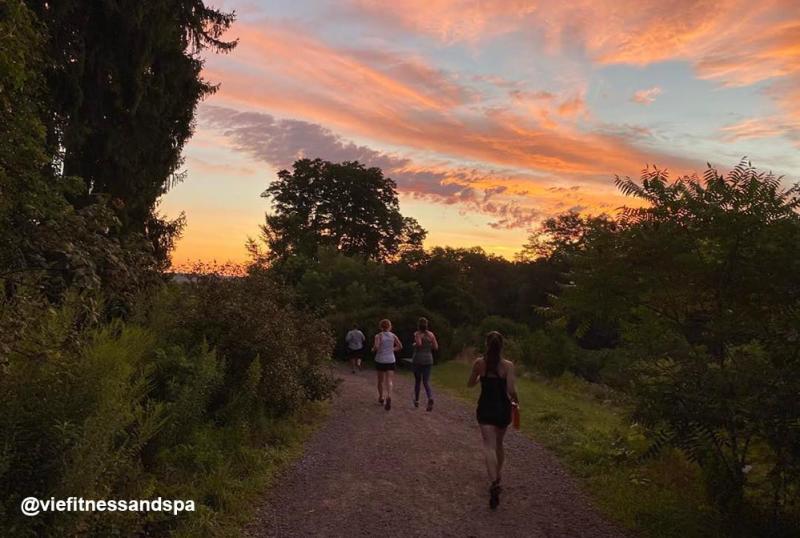 Sunset over runners in Nichols Arboretum