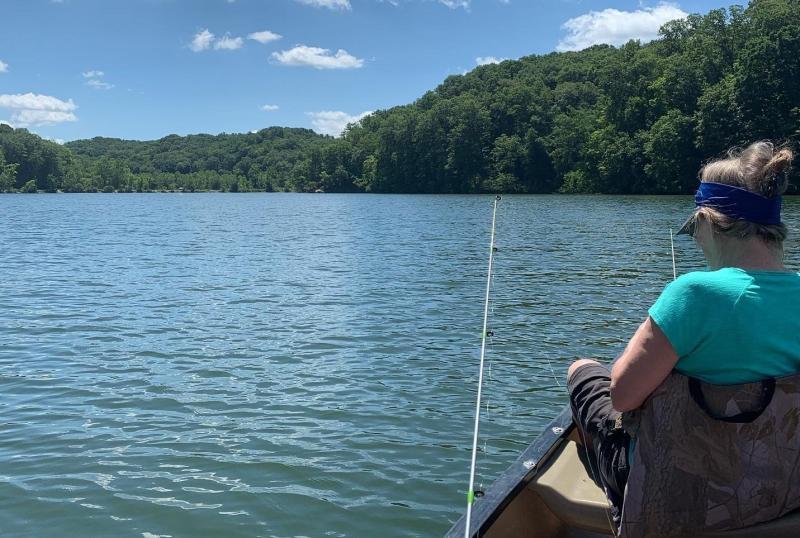 Woman fishing in a canoe on Griffy Lake