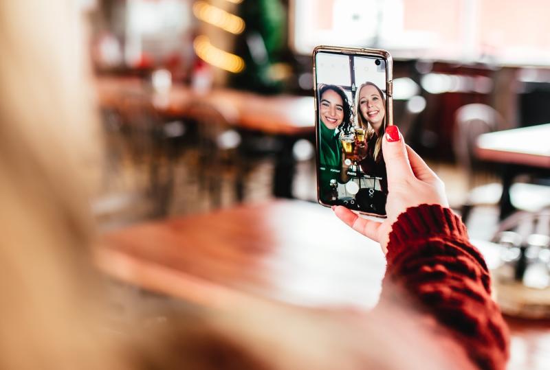 two people taking selfie