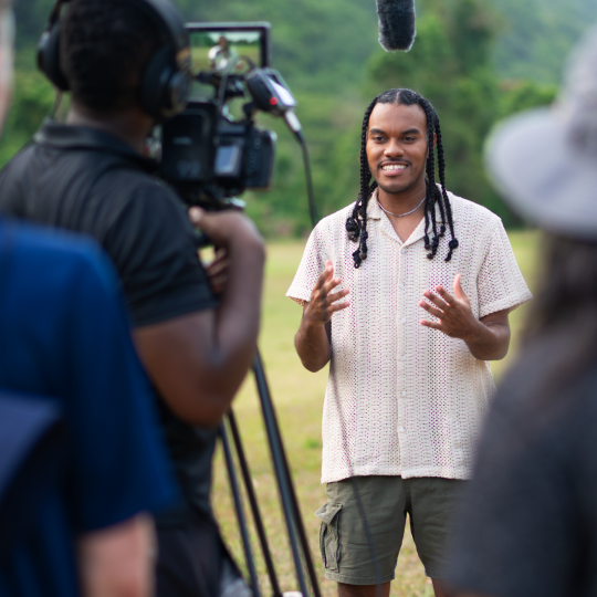 Justin Whitelocke in front of camera - More to Jamaica Host