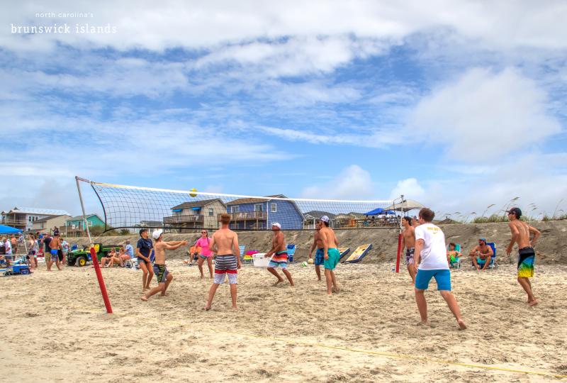 Group of guys playing beach volleyball