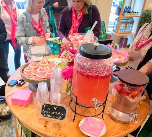 Pink cookies and pink punch on a table