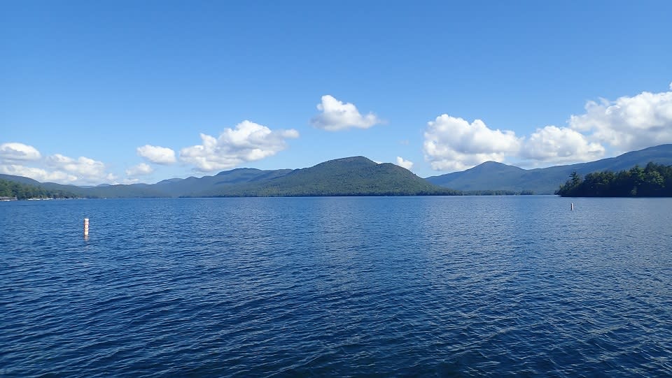 View of the Adirondack Mountains from a boat on Lake George