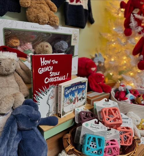 christmas books and stuffed animals on display