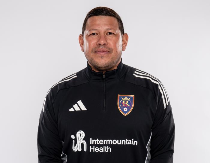 Serious looking man wearing a RSL jersey that also has intermountain health logo
