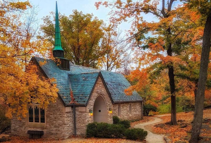 Beck Chapel surrounded by vibrant orange fall foliage