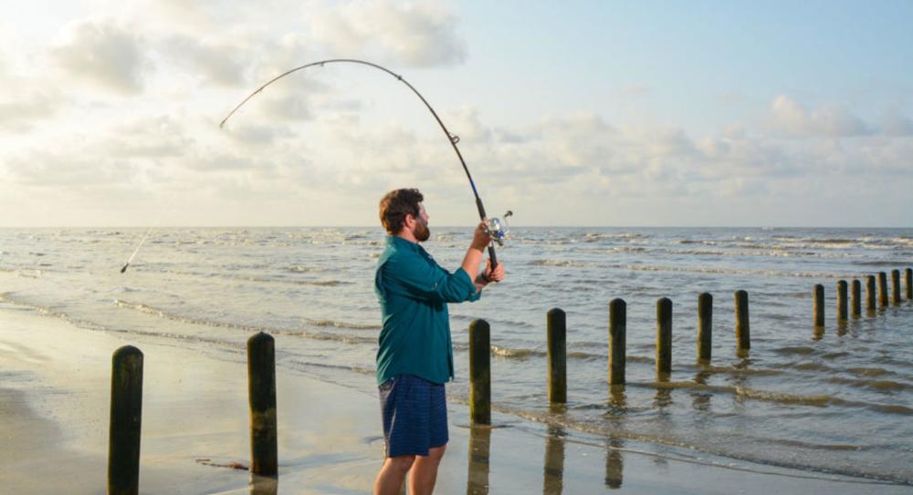 Man Fishing At Sea Rim State Park In Beaumont, TX