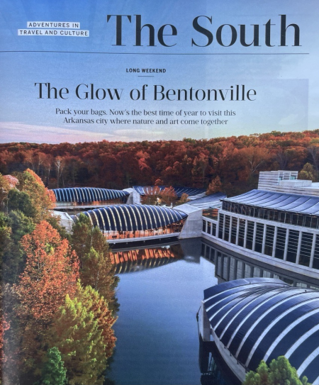 A photo of the Southern Living feature on Bentonville, titled The Glow of Bentonville with an aerial photo of Crystal Bridges Museum of American Art surrounded by fall foliage.