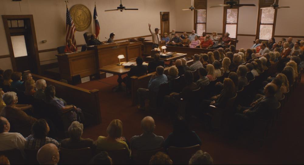 Bernie Screengrab showing a crowded room inside the San Augustine County Courthouse during Bernie's trial