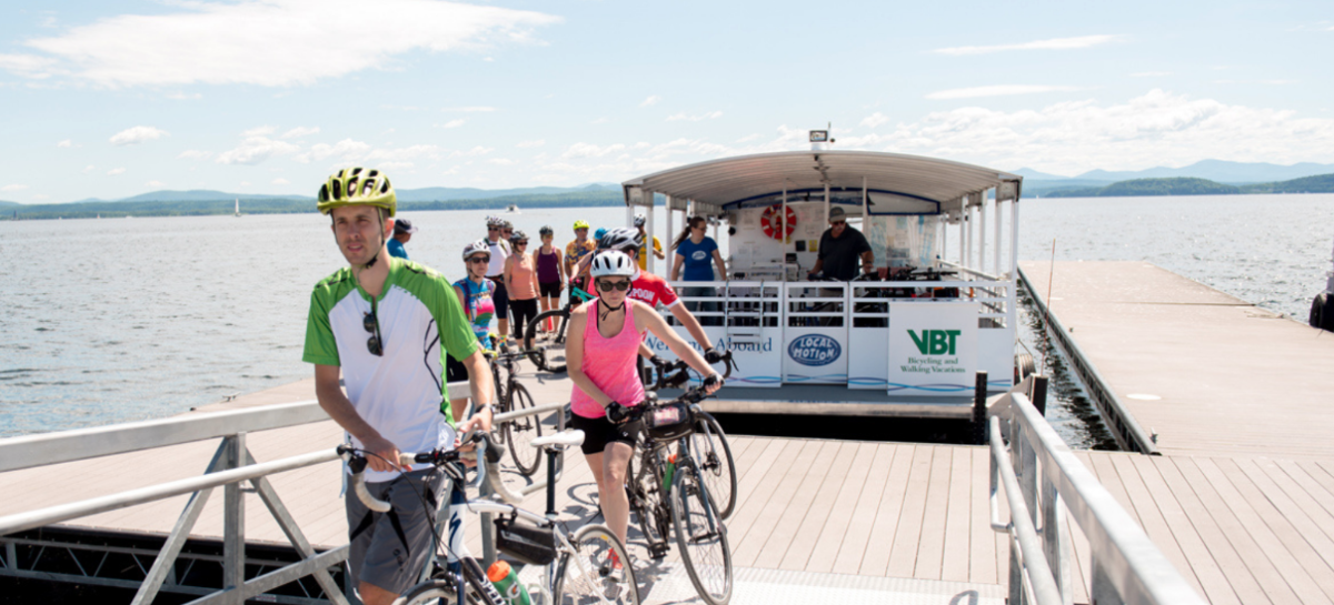 bikers walking off ferry on lake champlain
