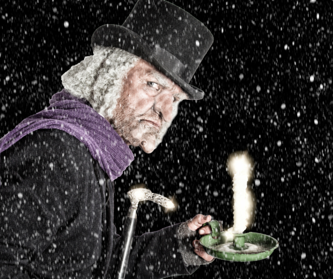 A Christmas Carol - Illustration of Ebenezer Scrooge Holding a Candle at Night