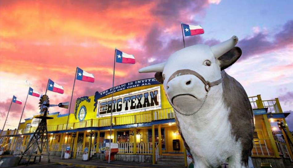 photo of the big texan with a sunset in the back