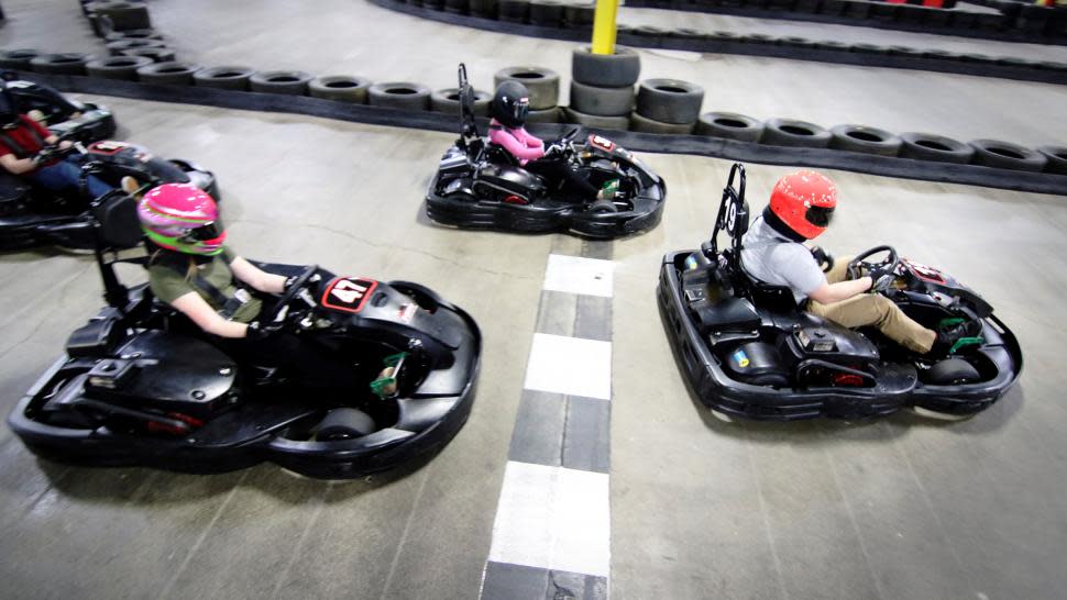 People enjoying indoor karting at Full Throttle.