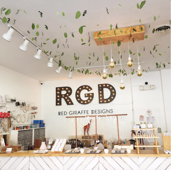 Red Giraffe Designs store sign