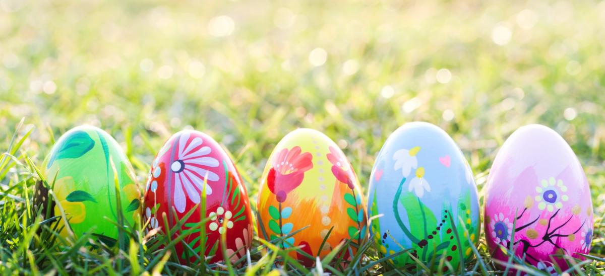 Five painted Easter Eggs on grass
