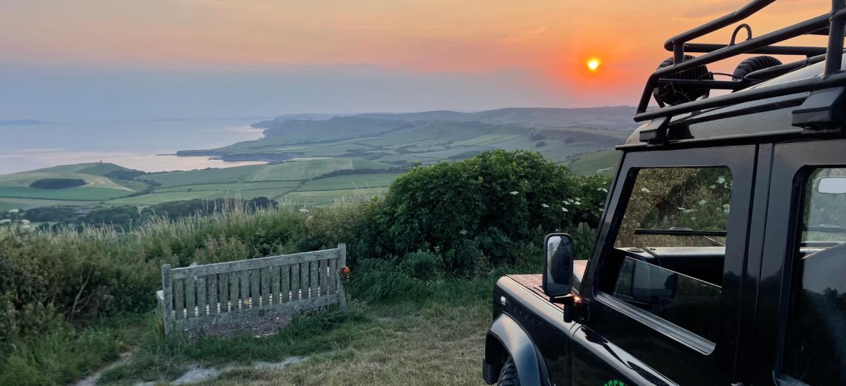 A Dorset Safari jeep overlooking Kimmeridge Bay in Dorset