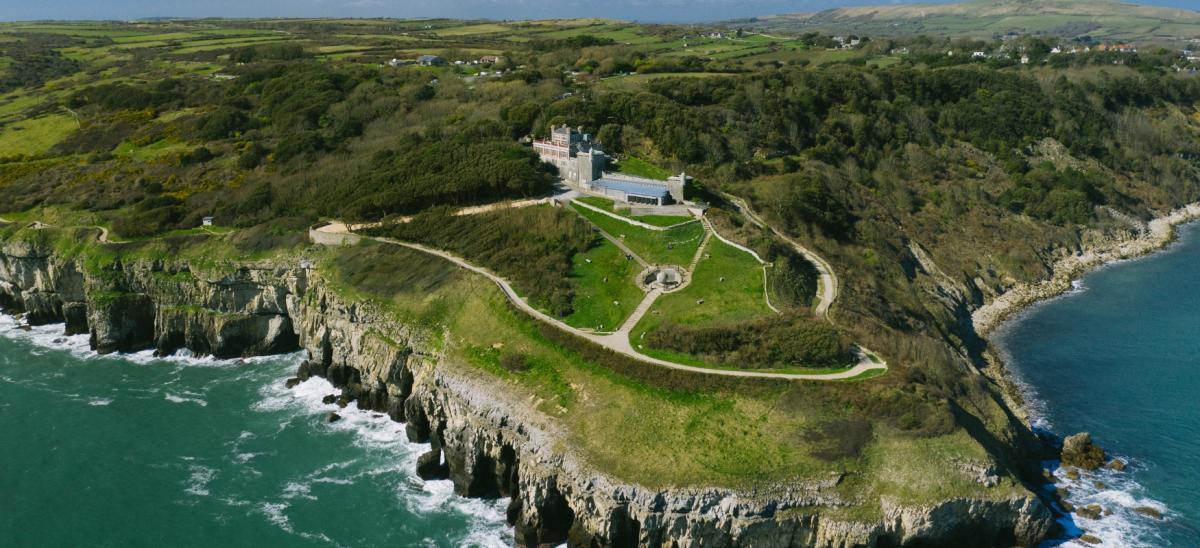 Aerial view of Durlston Country Park and Castle in Swanage, Dorset