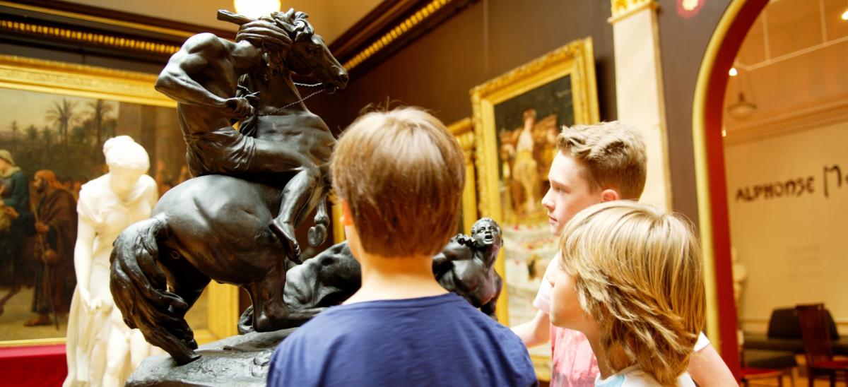 Three children inside the Russell-Cotes Gallery in Bournemouth, Dorset