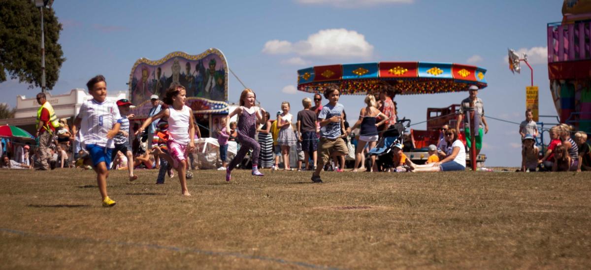 Children running in a race at Swanage Carnival