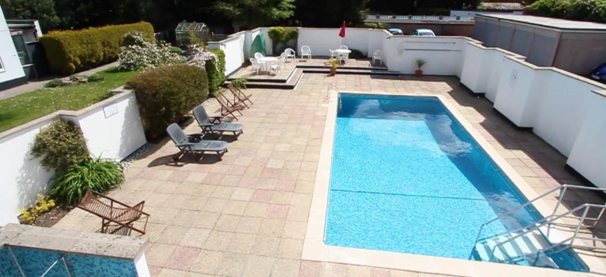 The outdoor swimming pool at The Greenhouse Holiday Retreat in Dorset