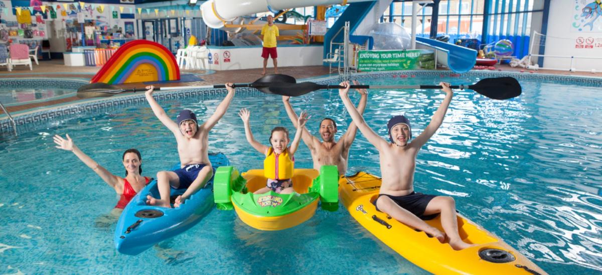 A family in the indoor swimming pool at West Bay Holiday Park in Dorset