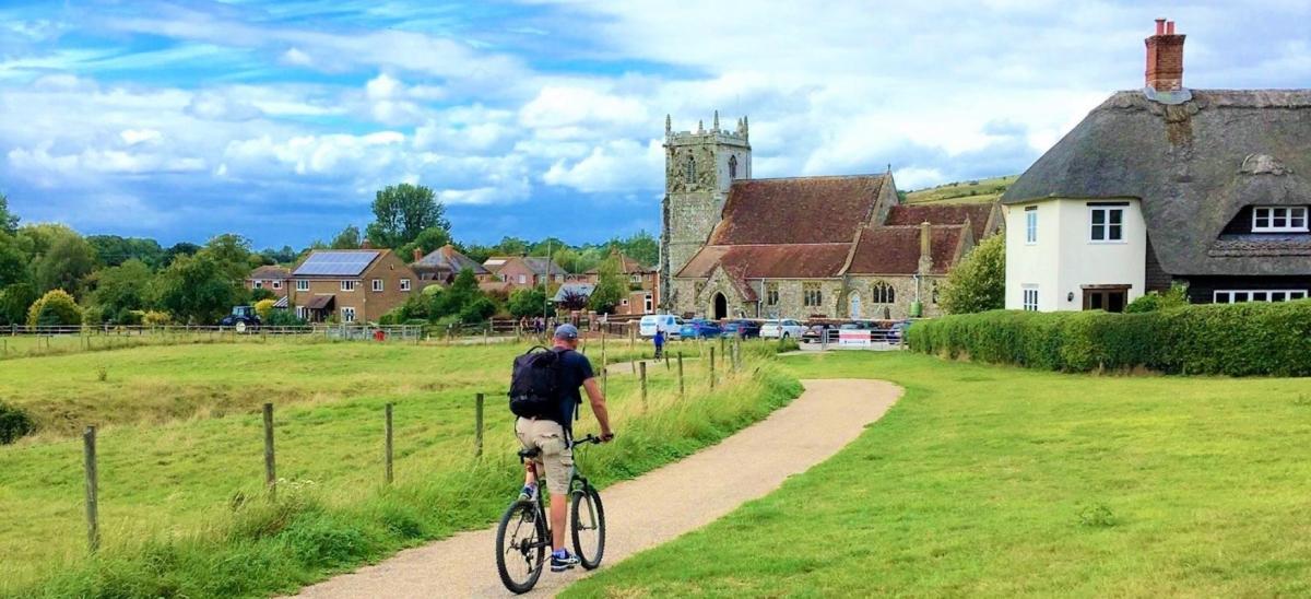 Man cycling on the North Dorset Trailway towards Stourpaine