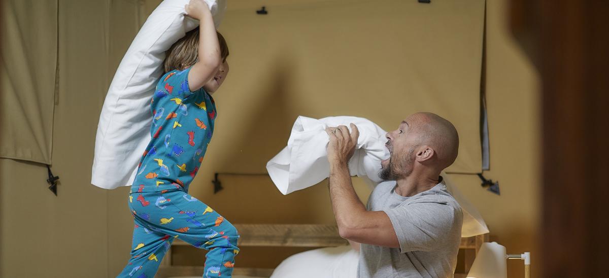 Two people having a pillow fight