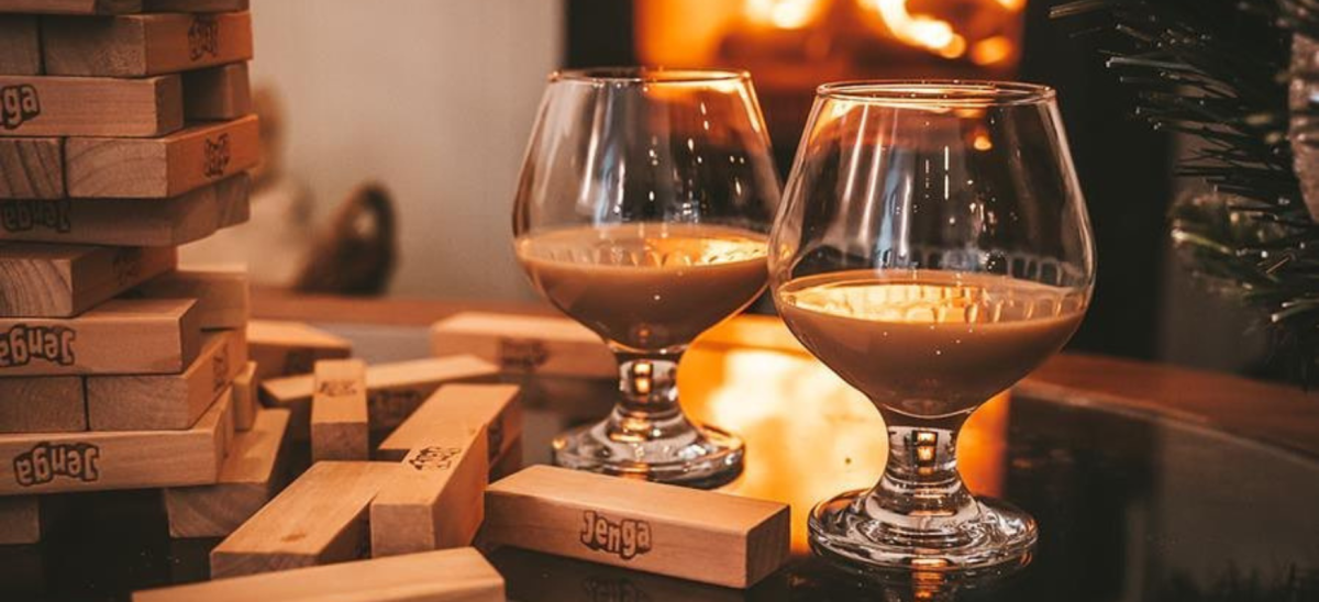 Baileys and jenga by a log fire