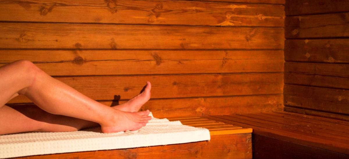 Woman in the sauna at Knoll House Hotel, Studland in Dorset